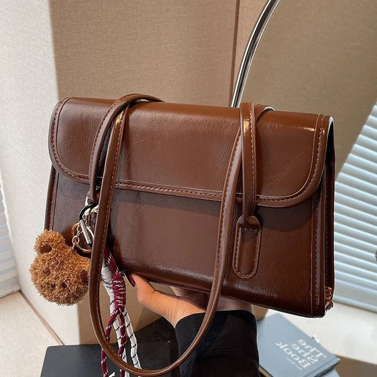 Brown women's horizontal square PU leather shoulder bag with pendant charm and double straps