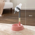 Green pet standing water dispenser with detachable pole and adjustable height settings on a floor.