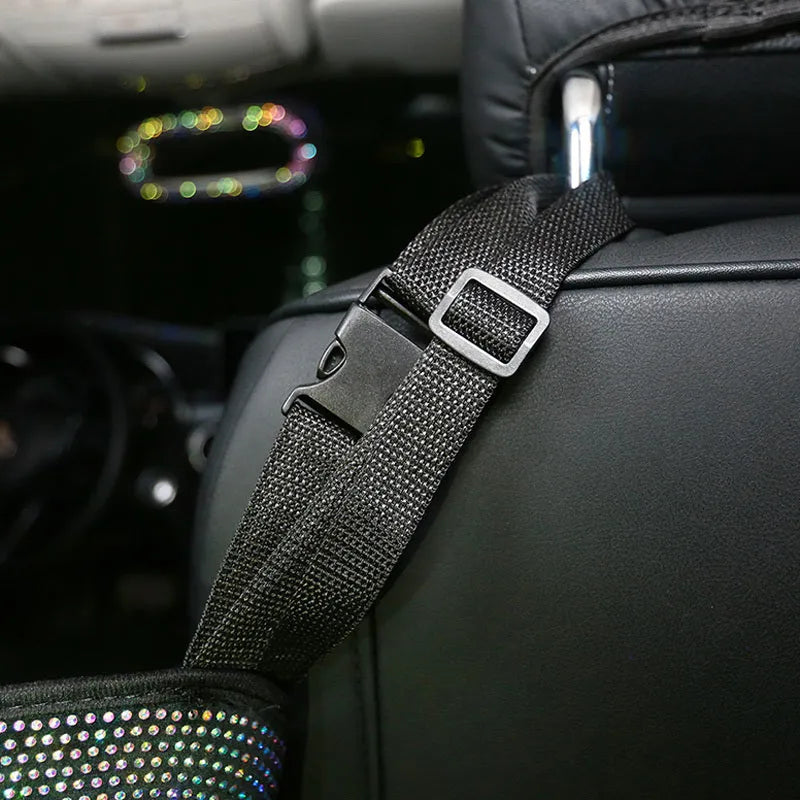 Crystal rhinestone car storage bag organizer with multi-pockets attached to backseat of car, showing white and colour options