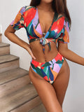 Red women's split-leg bikini swimsuit with triangle top on a mannequin.