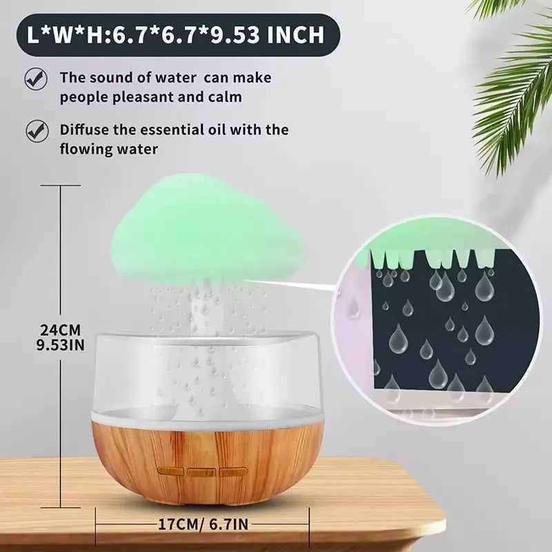 White rain cloud design desk humidifier and aromatherapy diffuser with mushroom-shaped night light on a wooden table.