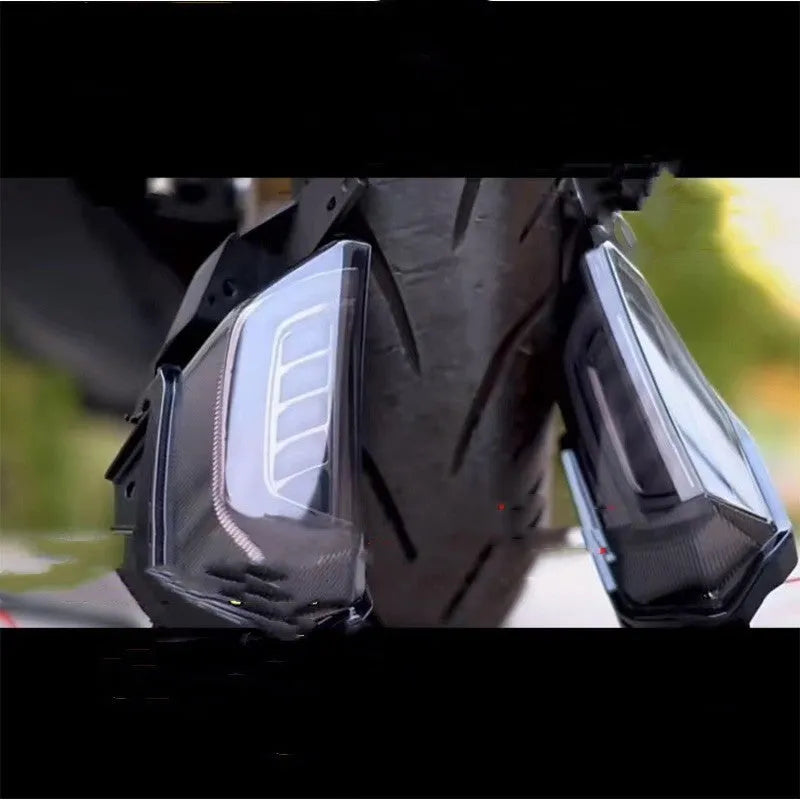 Pair of LED turn signal lights for Yamaha NMAX155 scooter in blue and yellow colour.