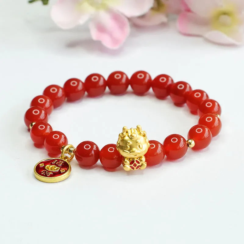 Close-up of a red agate bead dragon zodiac bracelet on a wrist, showing 8mm beads.