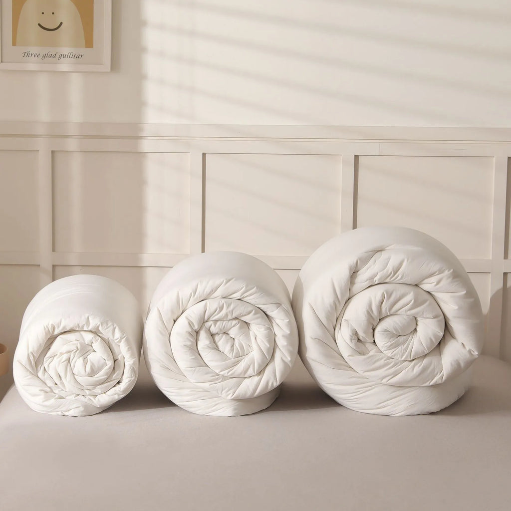 Soybean fibre quilt with pure cotton twill cover in grey, shown on a bed.