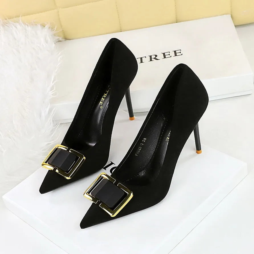 Black suede women's high heel court shoes with a 9cm stiletto heel and pointed toe on a rubber sole.