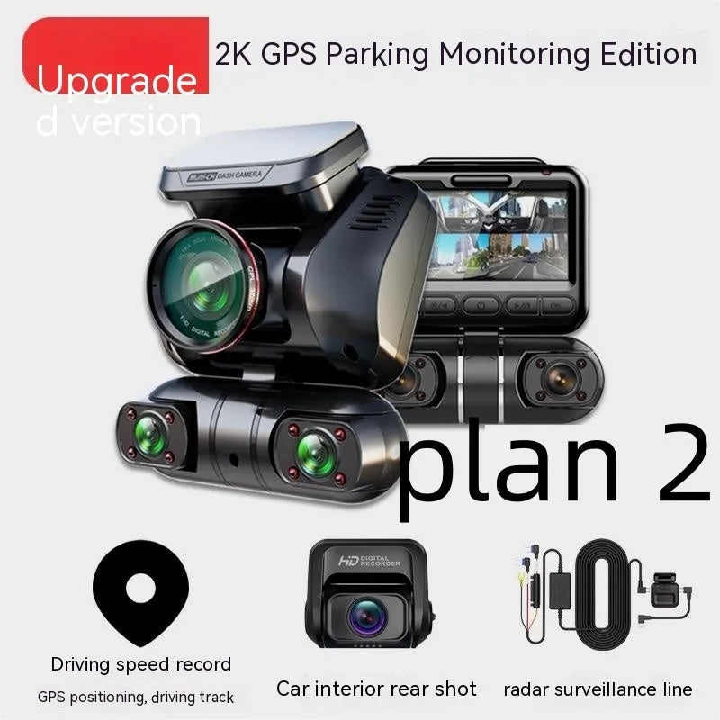 Black four-lens car dash cam with 2-inch screen mounted on a car windscreen.