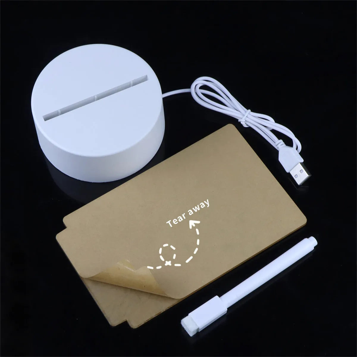 Heart-shaped LED light note board with USB warm yellow illumination on a desk