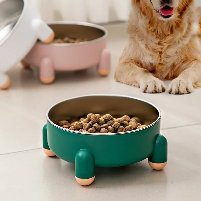 Green ceramic-coated stainless steel pet bowl with non-slip base and raised high-foot design.