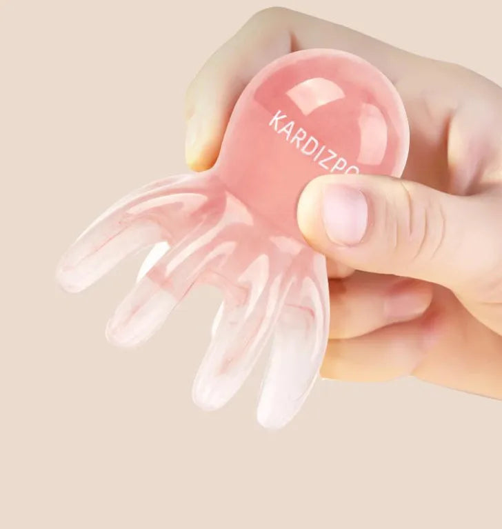Pink octopus-shaped facial massage comb for periocular meridian stimulation with storage bag