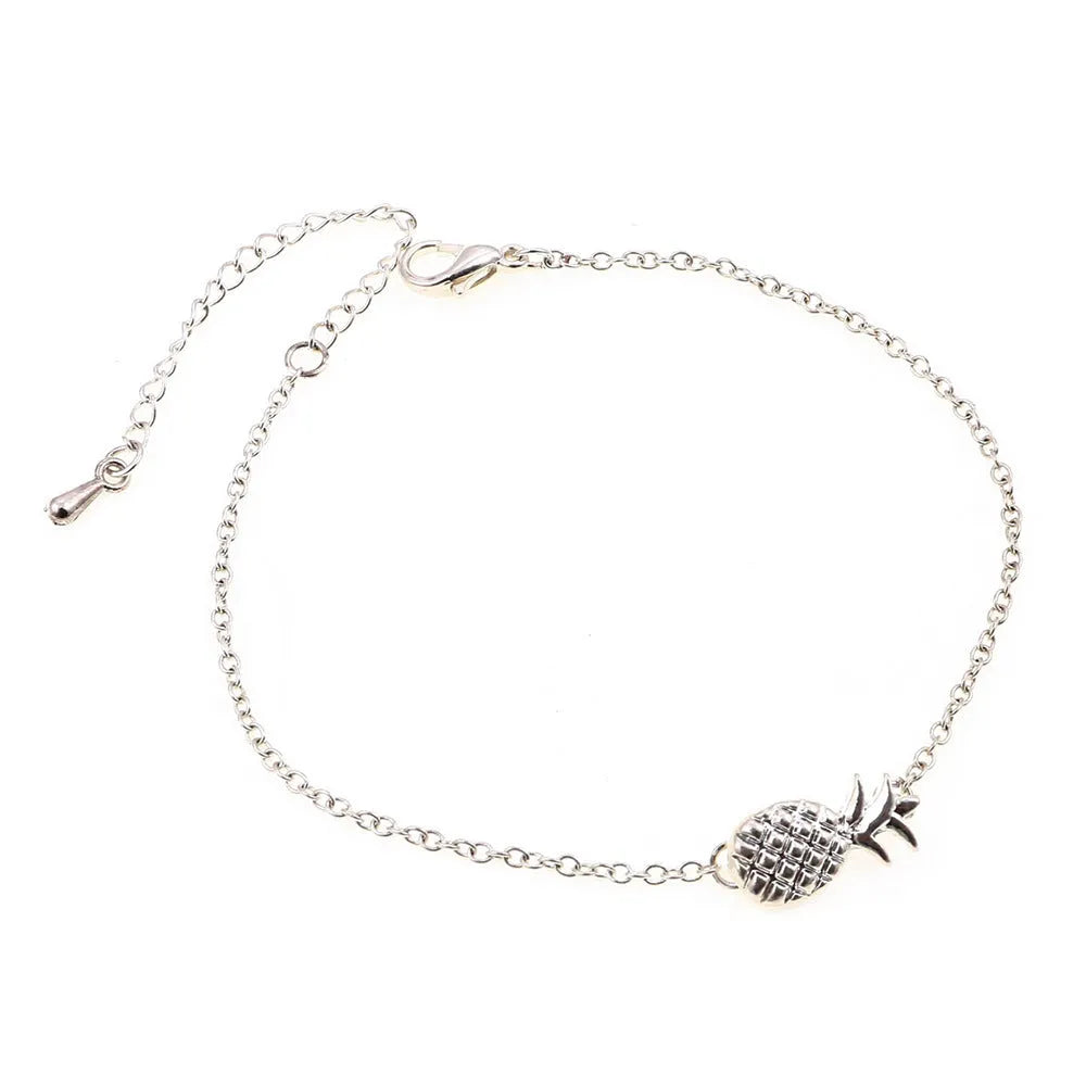 Gold or silver alloy bracelet featuring a pineapple charm, from the XINGX women's jewellery series.
