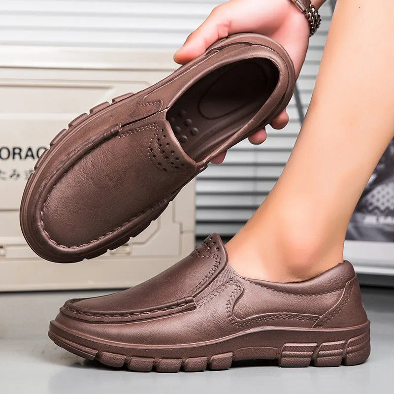 Men's black mid-top slip-on work shoes with platform sole, artificial leather upper, and round toe