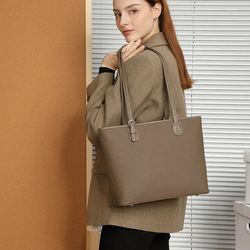 Genuine leather retro women's tote bag in horizontal square shape, showing internal zipper and phone pockets.