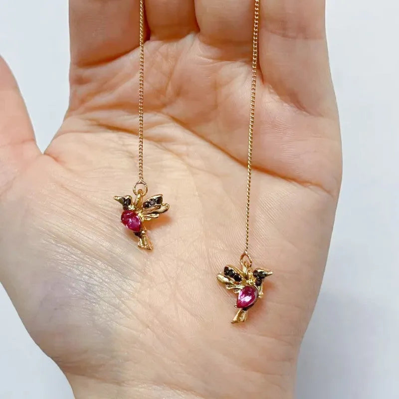 Women's long hanging earrings with bird motif in red, blue, or red lvzuan electroplated alloy.