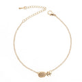 Gold or silver alloy bracelet featuring a pineapple charm, from the XINGX women's jewellery series.