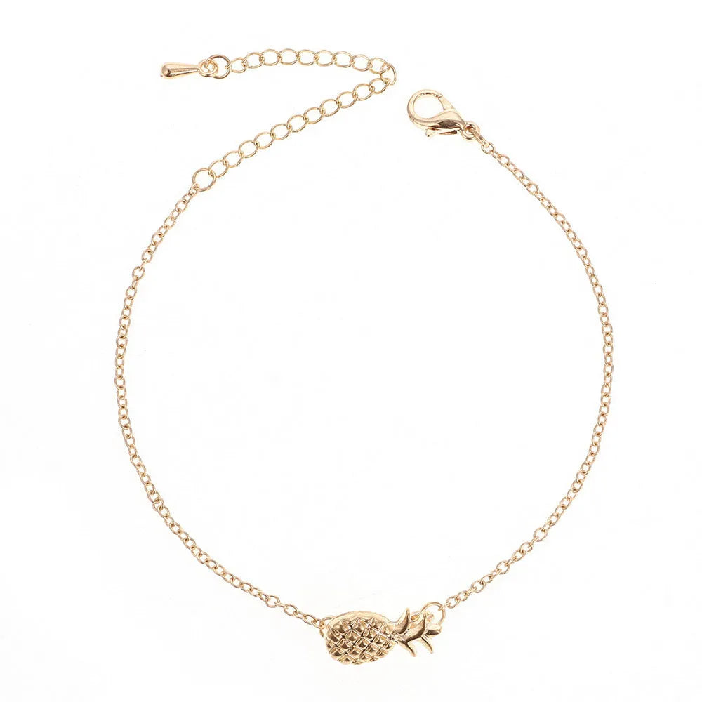 Gold or silver alloy bracelet featuring a pineapple charm, from the XINGX women's jewellery series.