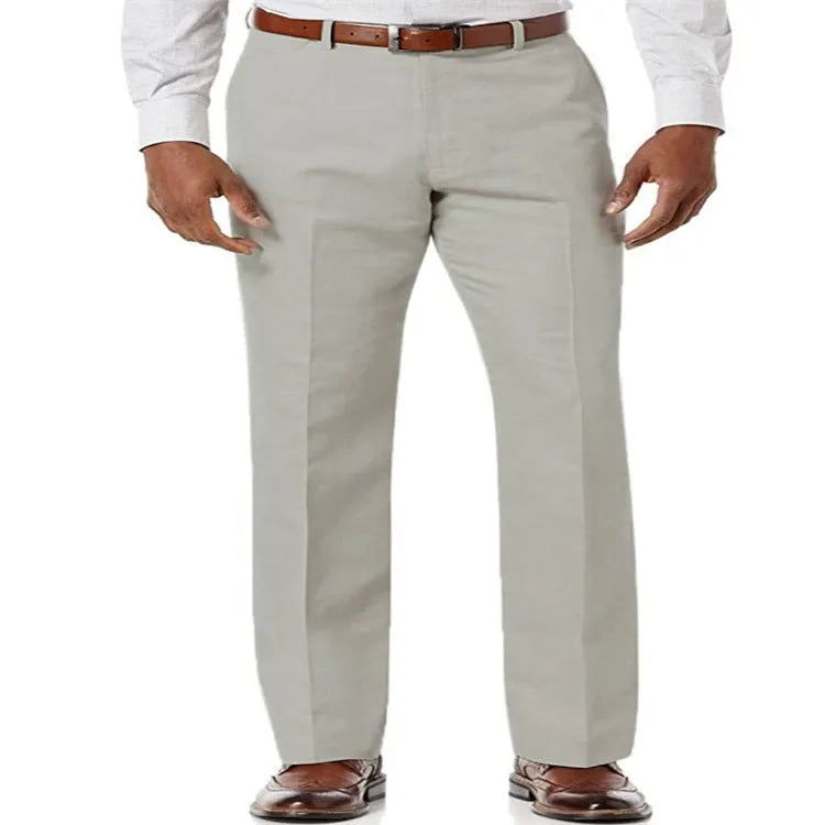Men's beige linen trousers with slant pockets laid flat on a surface.