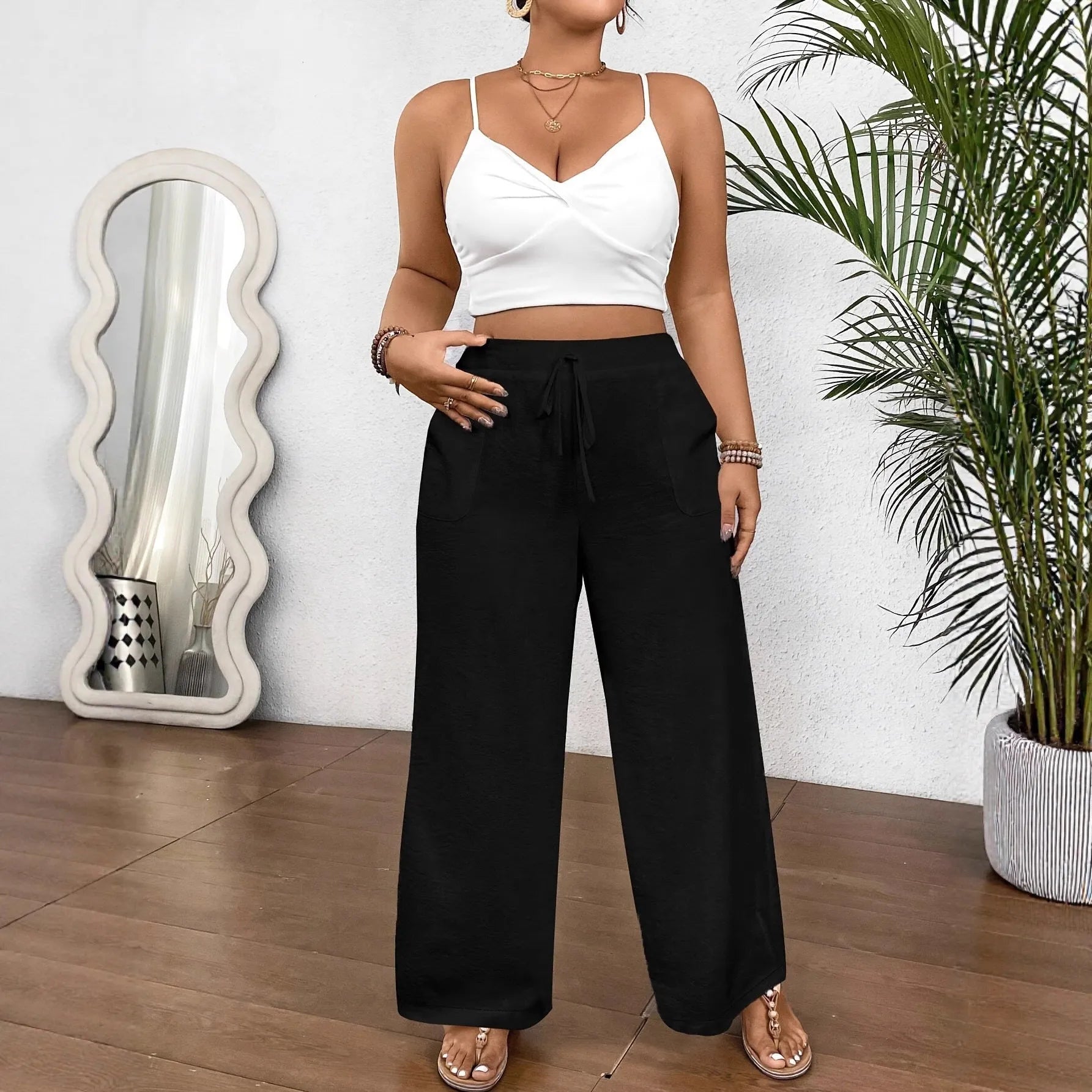 Drawstring wide leg loose fit women trousers in khaki colour with side pockets and drawstring waist.