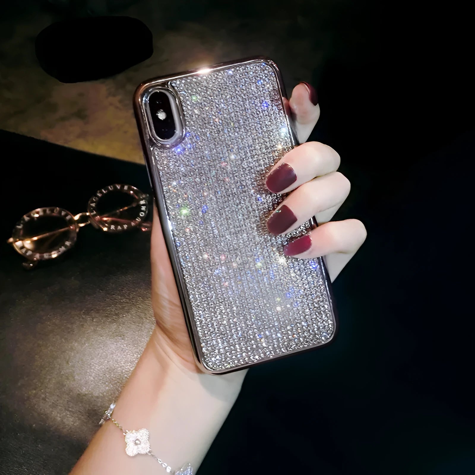 Silver rhinestone decorated silicone phone case for iPhone models showing full diamond pattern