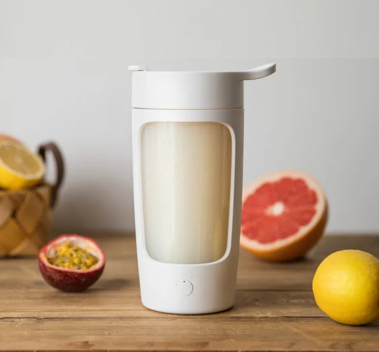 Portable automatic blender cup in four colour options showing compact design with integrated drinking vessel