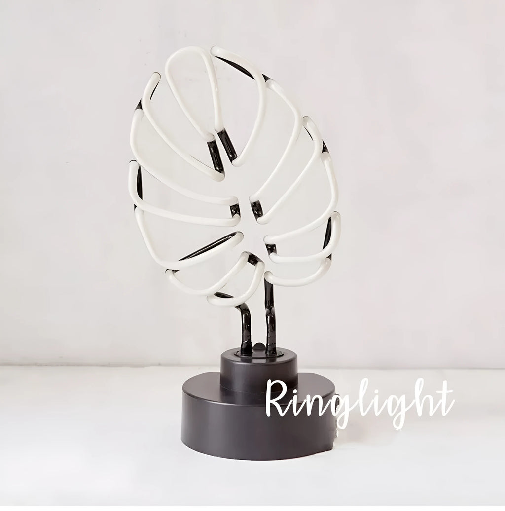 White minimalist bamboo-shaped desk lamp with green light, showing large and small size options.
