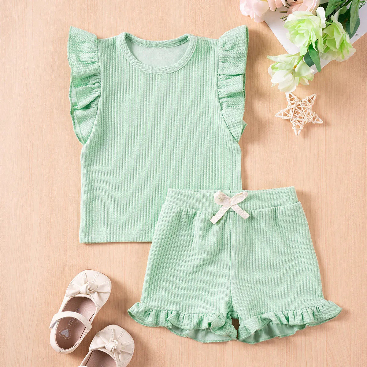 Girls' solid colour summer suit with flounced sleeves and shorts in knitted polyester for children 80-120cm