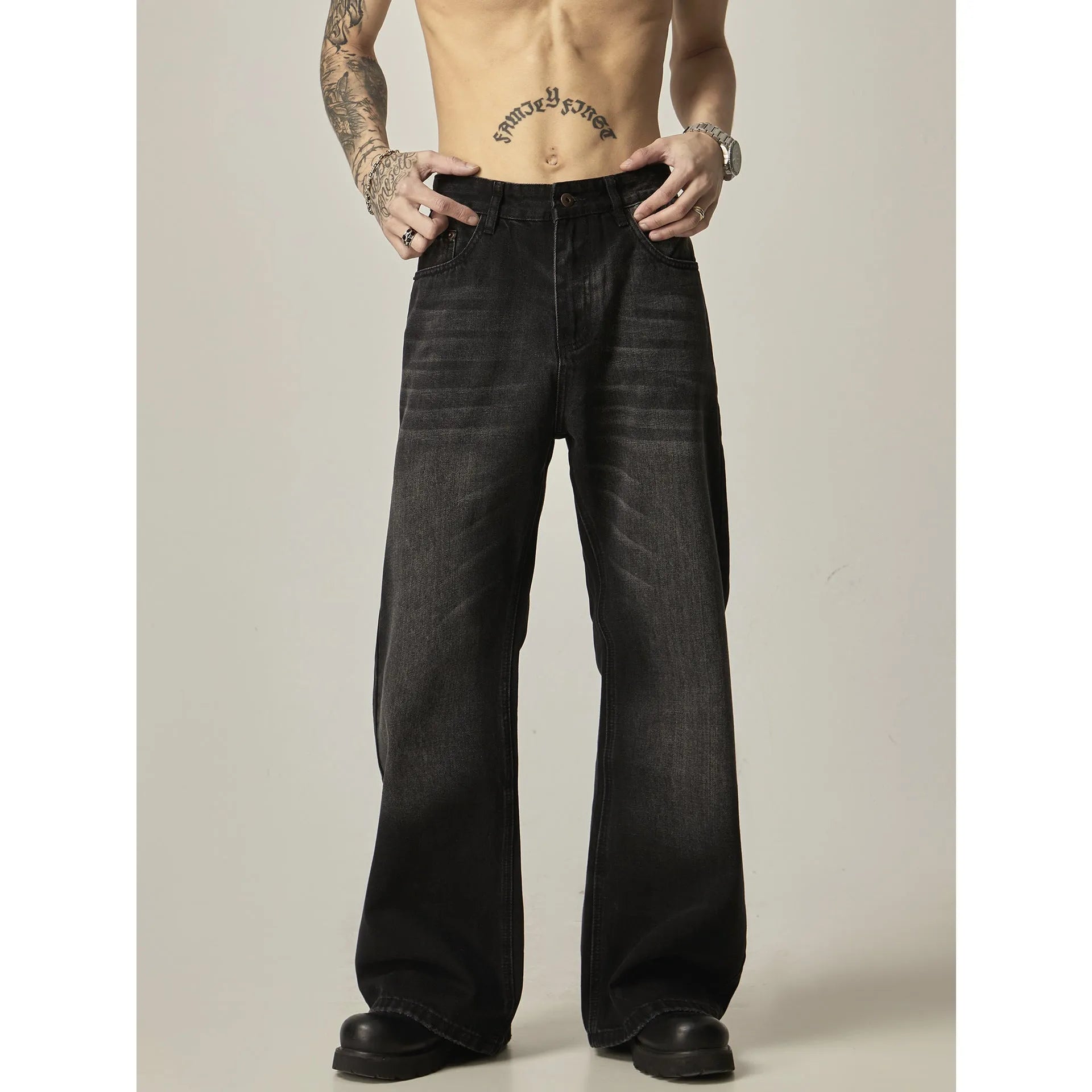 Black loose straight leg jeans with retro styling and zipper fly closure