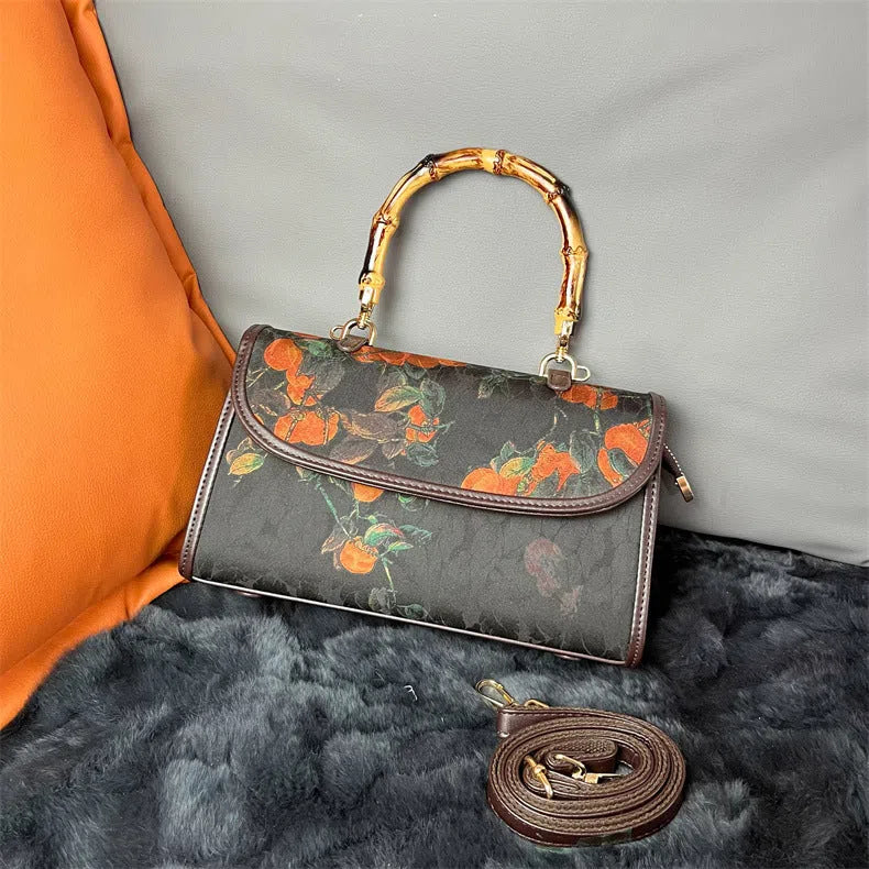 Vintage Chinese-style Xiangyun silk handbag with retro patterns, horizontal rectangular shape and single strap.
