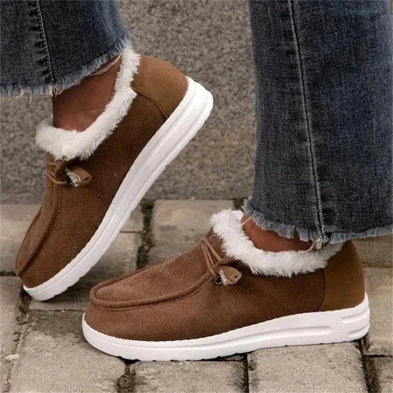 Women's winter snow boots with cotton upper and plush lining in grey, side view showing front-tie lacing and ankle height