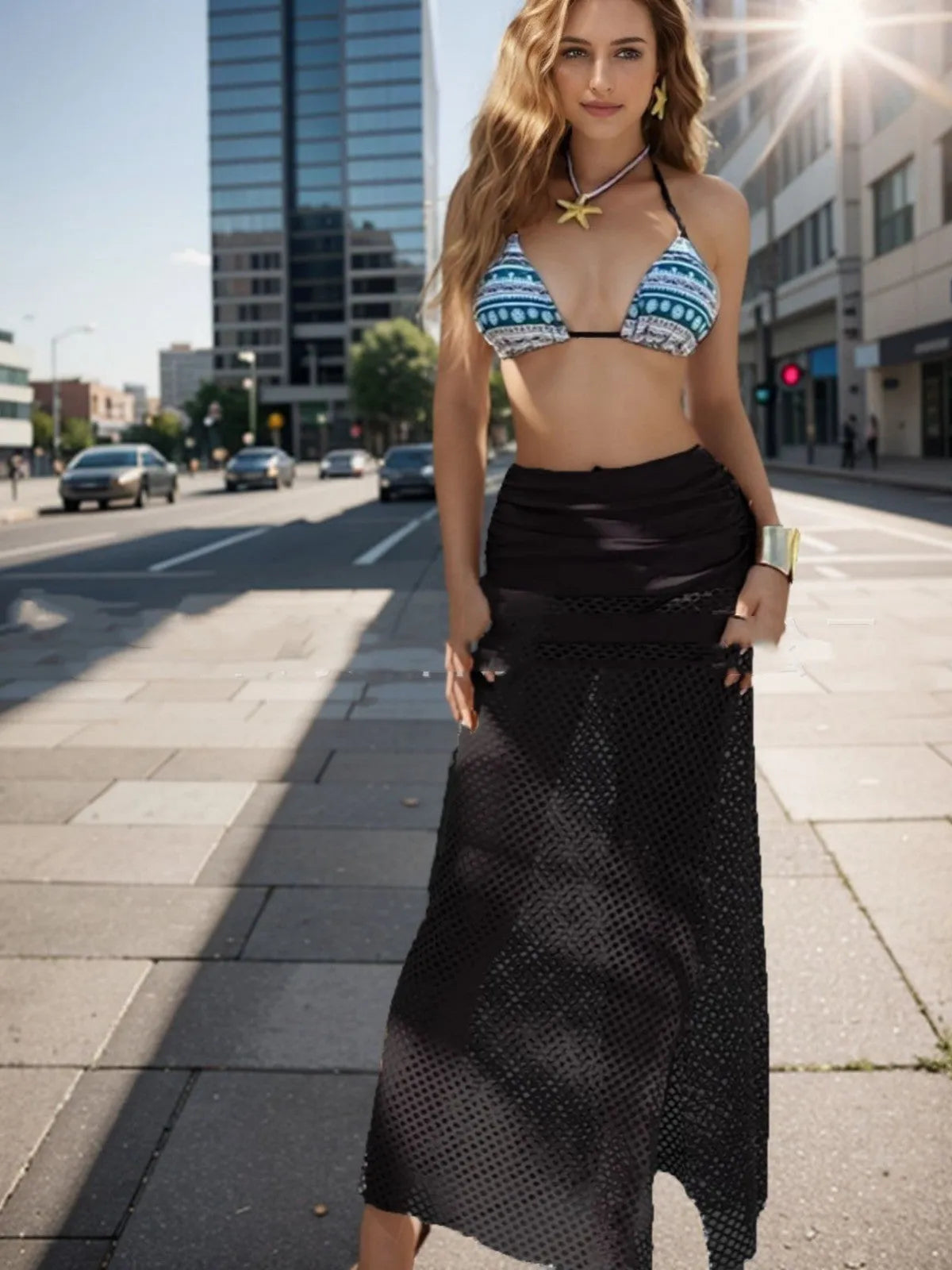 Women's three-piece bikini set with a fishnet long skirt in a gradient pattern.