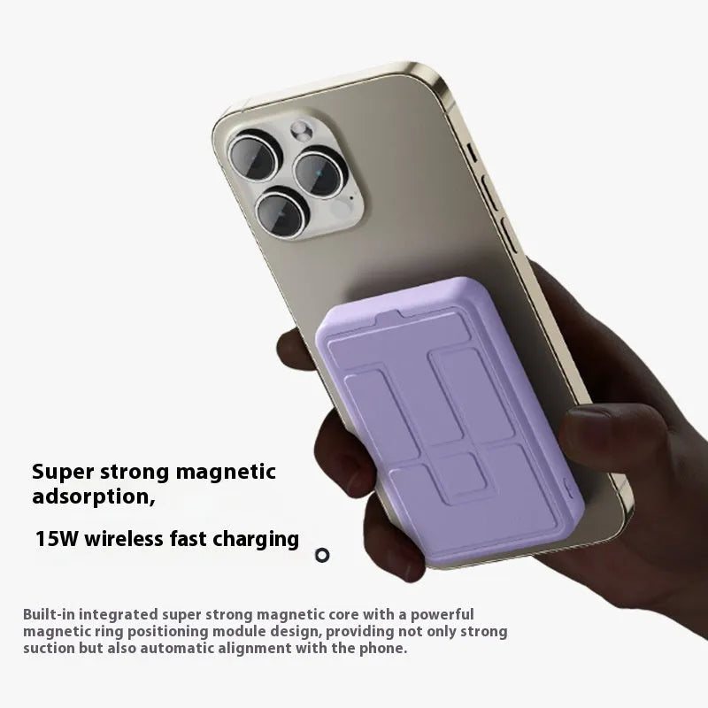 Magnetic wireless power bank with bracket in white, showing 10000mAh capacity and USB port, on a desk