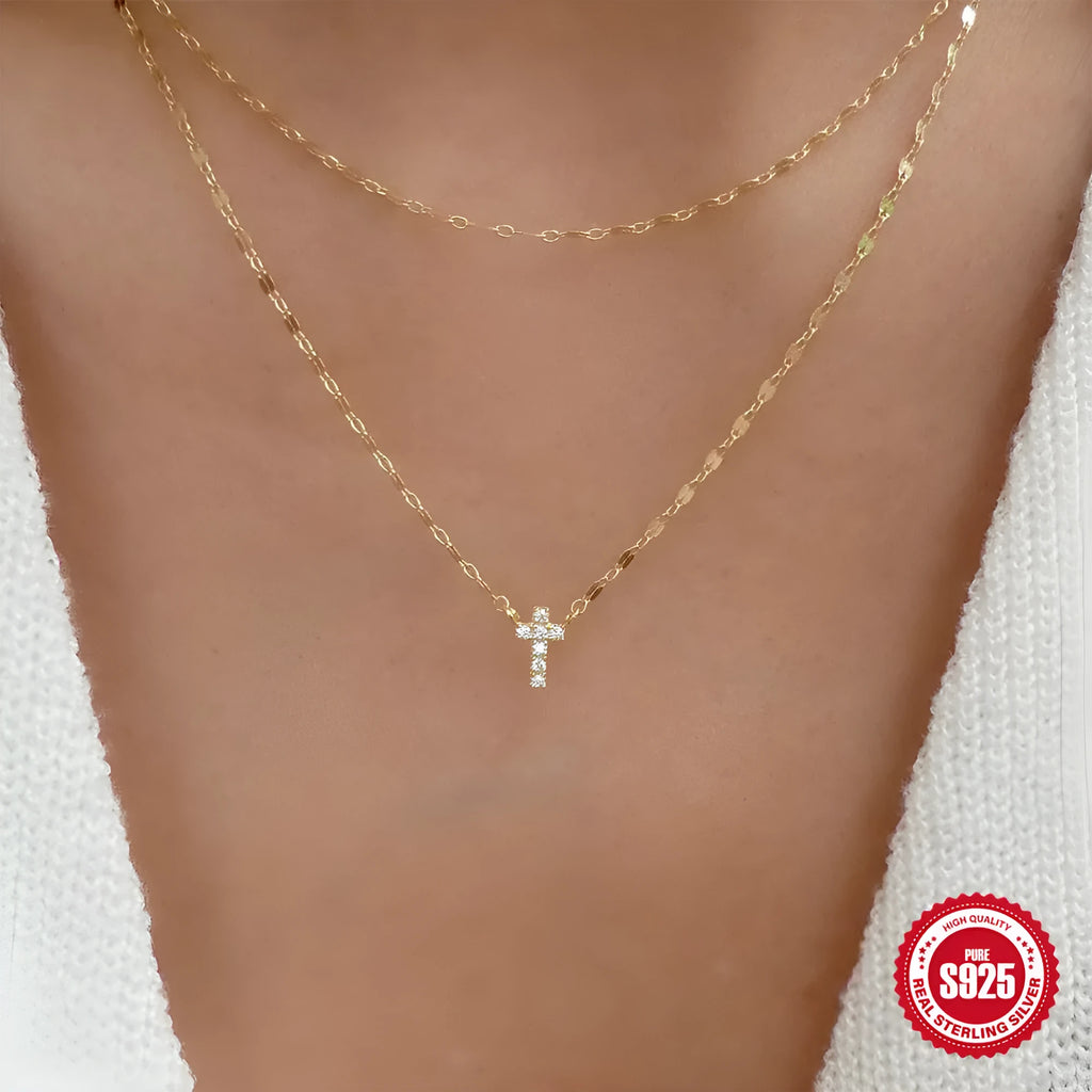 S925 sterling silver double layer cross pendant necklace with diamond cut detail on a clavicle chain.