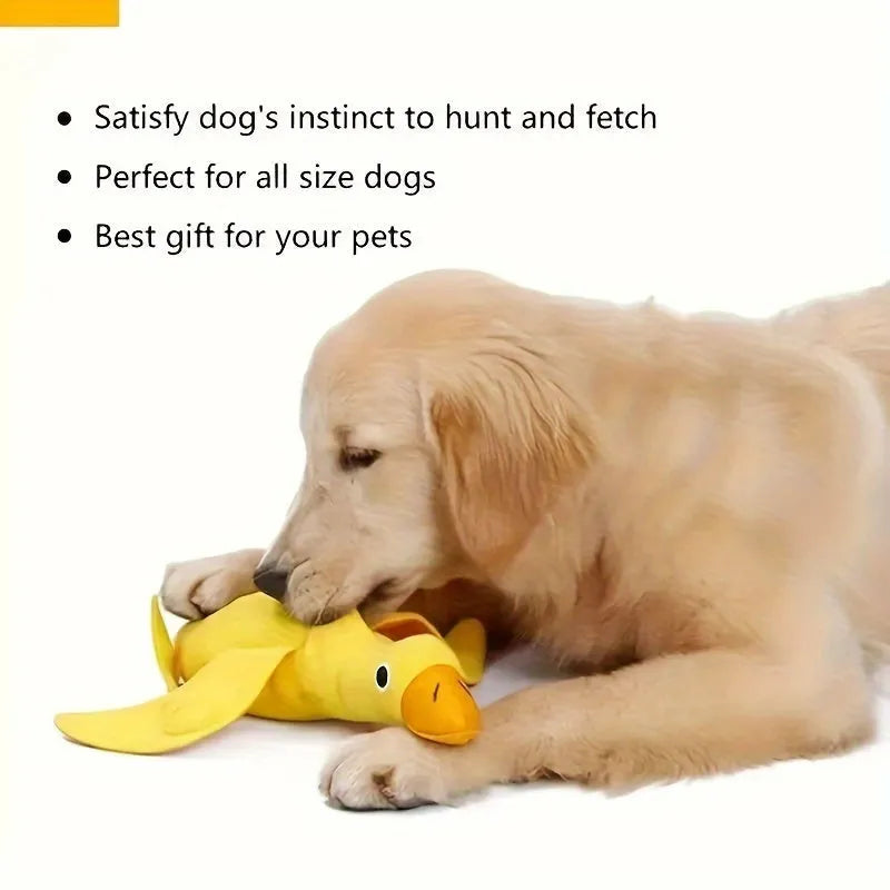 Yellow rubber duck dog toy with squeaker and treat compartment for puppy training and teething.