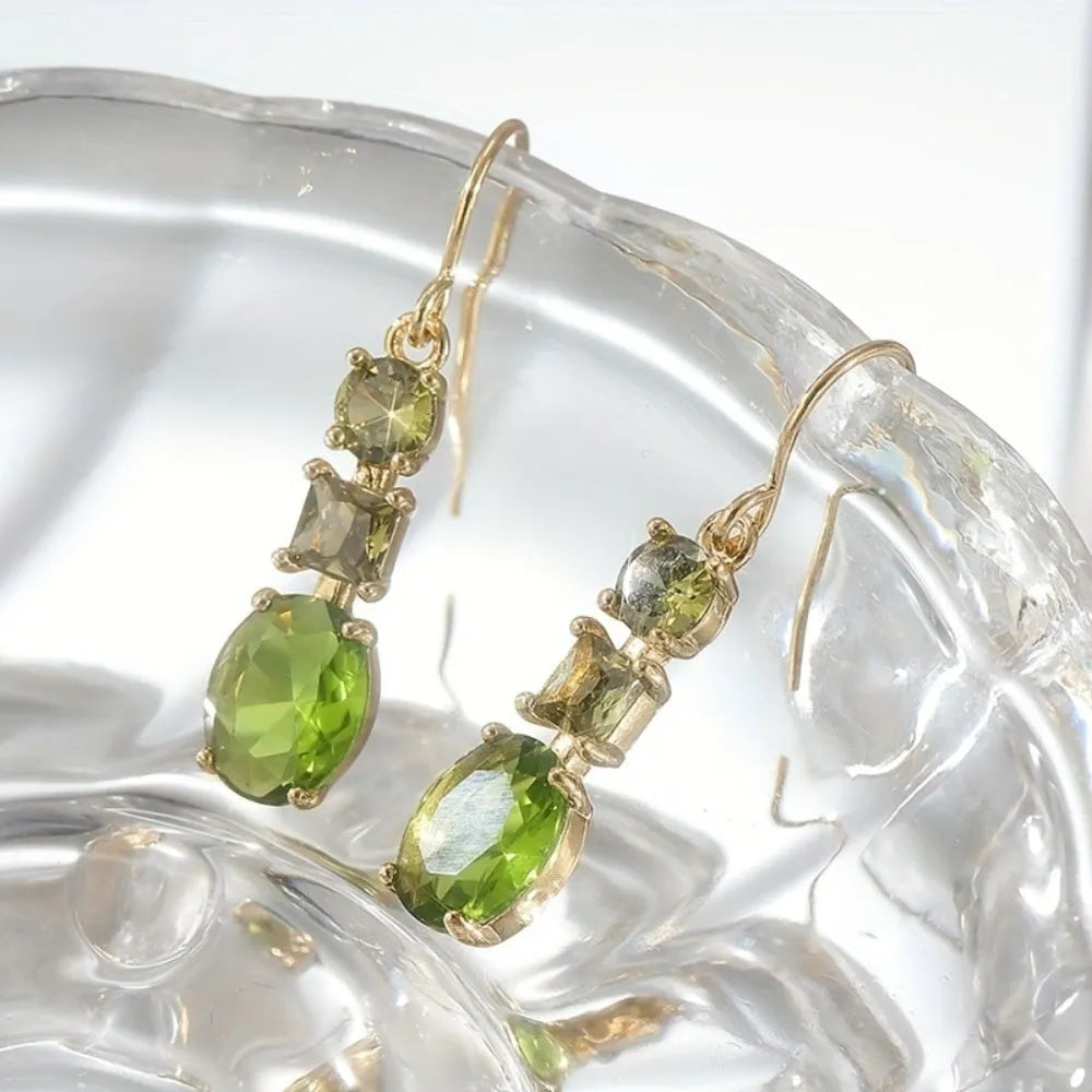 A pair of green geometric copper earrings with a quadrilateral shape and retro bohemian style.