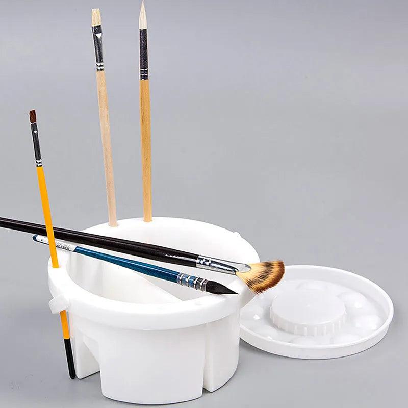 White plastic art brush holder with cake mould design measuring 16.5cm diameter