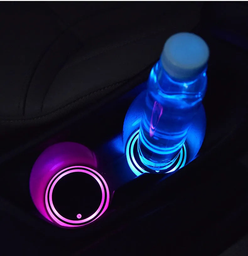 Colourful LED light-up coaster for a car cup holder showing multiple light colours on a 68mm acrylic and ABS mat.