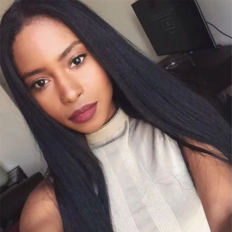 Long straight black synthetic wig with centre-parted bangs on a mannequin head.