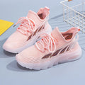 Women's white genuine cowhide high-top sports casual shoes with a flat, lightweight plastic sole on a wooden floor.
