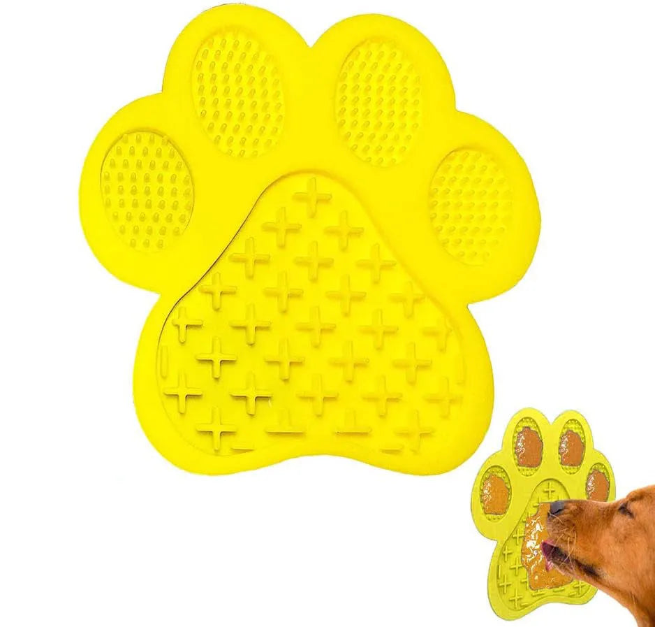 Blue bone-shaped silicone dog licking mat with suction cups on back for wall mounting during bathing.