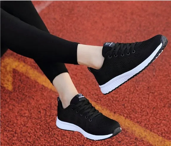 Women's breathable mesh flat heel sports shoes available in black, pink, and rose red colours