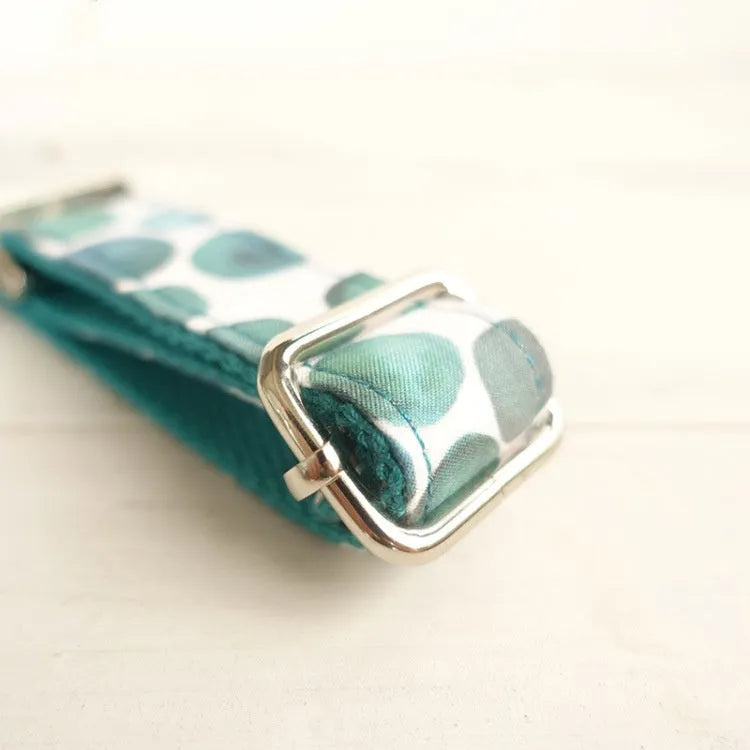 Blue bohemian polyester dog collar with adjustable sizing on a white background