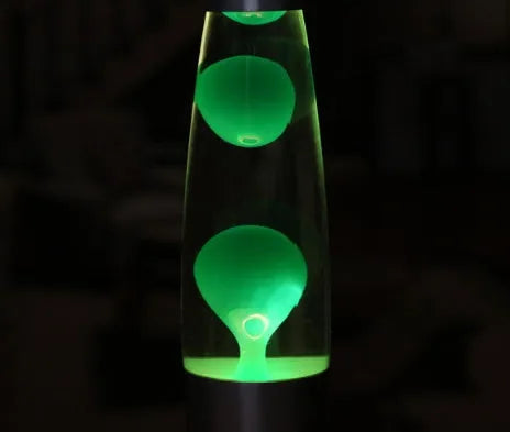 Blue lava lamp with metal base and glass bottle showing wax rising in heated liquid