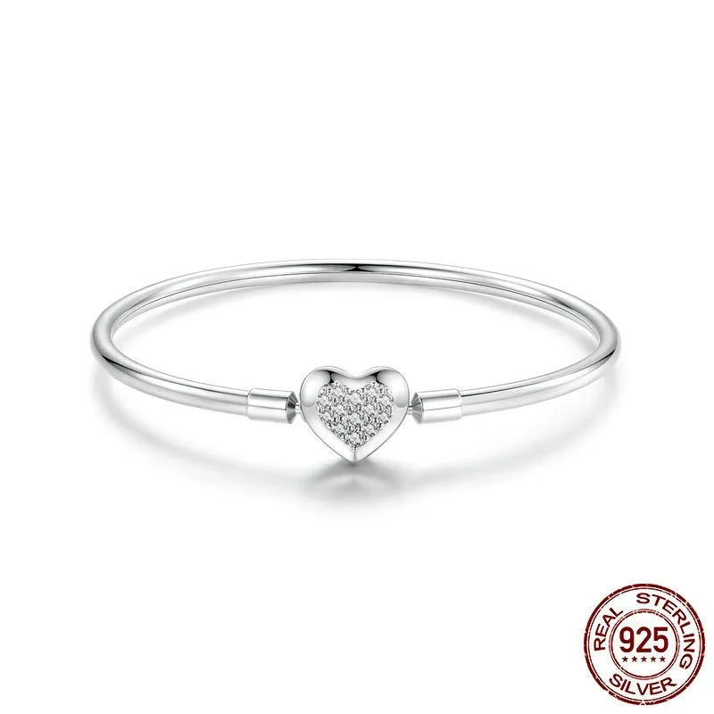 S925 sterling silver heart-shaped cubic zirconia bracelet with buckle clasp on white background