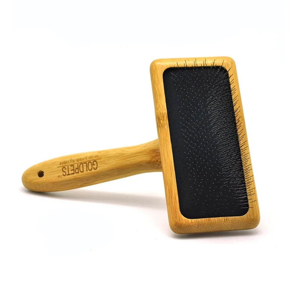 Goldpets bamboo and wood slicker brush for grooming cats and dogs with long prongs.
