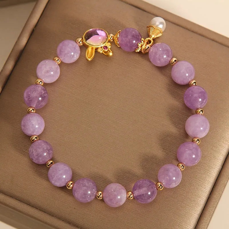 Purplish red jade rabbit hare head charm on a crystal Mori style bracelet.