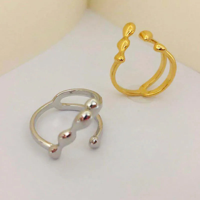 Brass spherical ring for women in gold or silver plating.