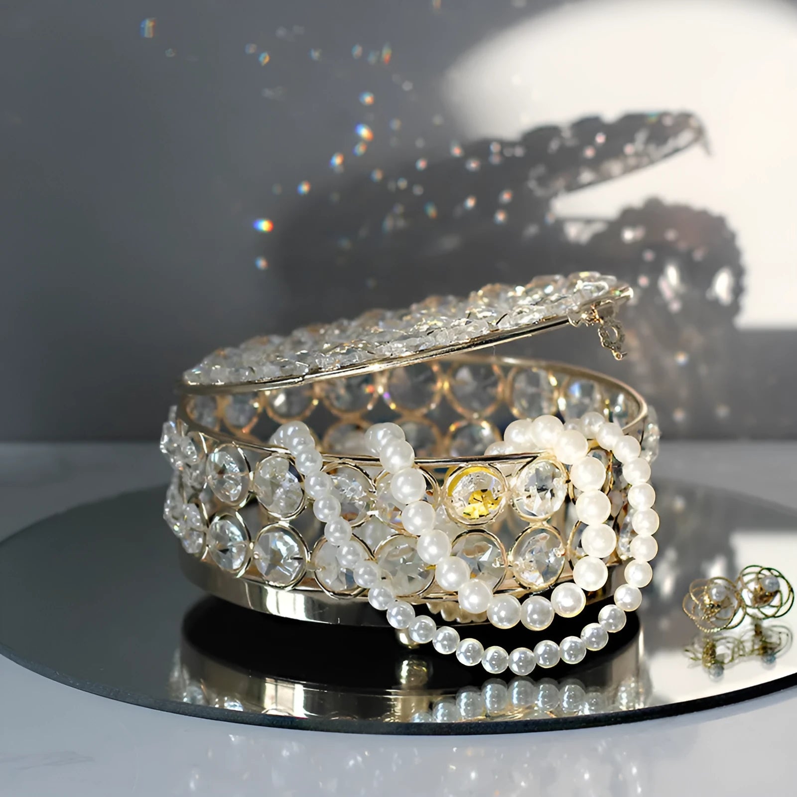 French gold iron frame transparent crystal glass jewelry storage box on a table