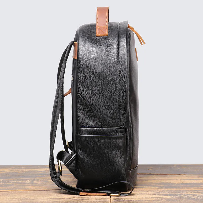 Genuine leather top grain cowhide expandable travel backpack in black with curved shoulder strap
