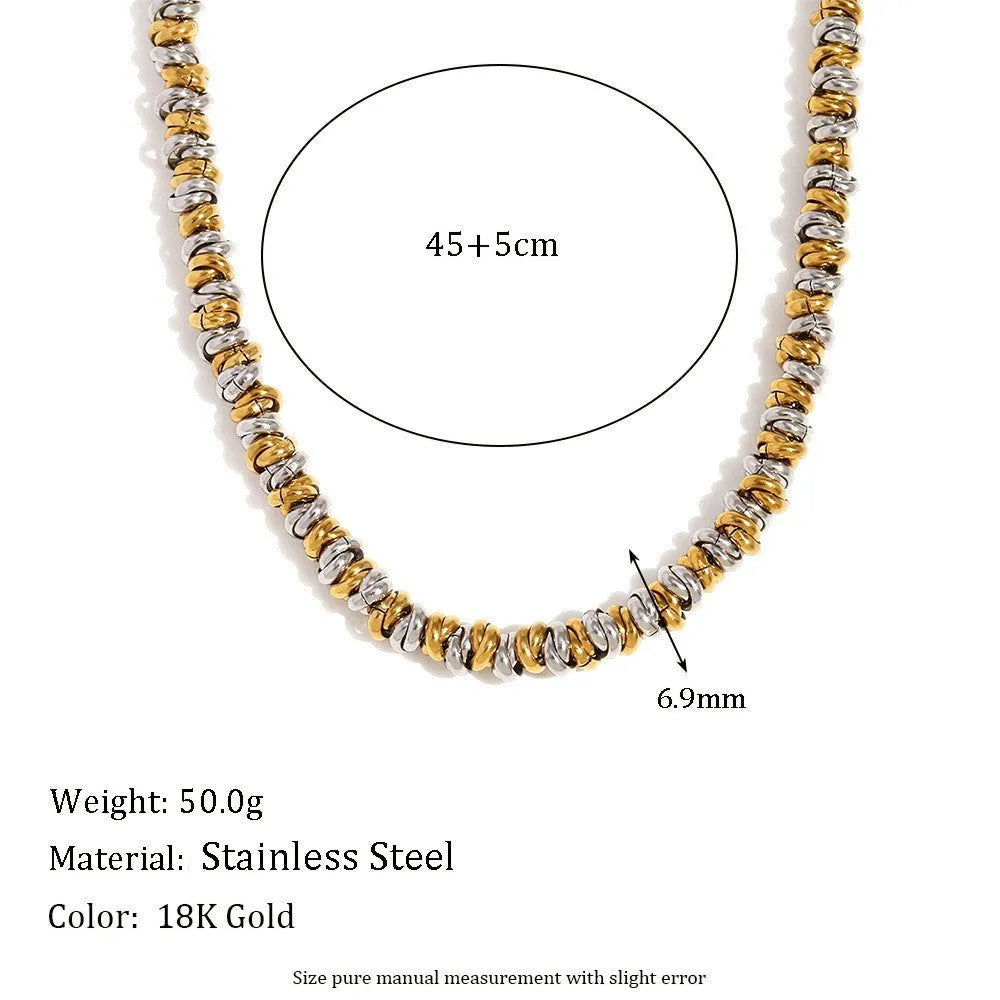 Gold geometric jewellery set with earrings, bracelet, and necklace on white background
