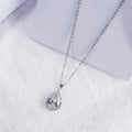 Women's water drop shaped pink necklace with rose gold rhinestone geometric detailing on alloy chain