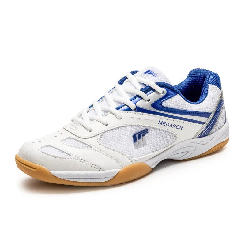 Table tennis sneakers in white and red colour with mesh upper, natural rubber outsole and front lace-up closure